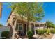 Cozy home exterior with a covered porch, inviting curb appeal, and a serene outdoor setting at 3783 E Stiles Ln, Gilbert, AZ 85295