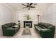 Bright living room features tile floors, a cozy fireplace, and comfortable seating for relaxation at 3783 E Stiles Ln, Gilbert, AZ 85295