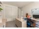 Home office features a large desk, closet, and neutral walls, offering a flexible workspace at 3783 E Stiles Ln, Gilbert, AZ 85295