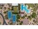 This aerial view features community amenities: tennis courts, a pool, a playground, and a basketball court at 3824 E Parkside Ln, Phoenix, AZ 85050