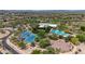 This aerial view highlights community amenities: tennis courts, a basketball court, and a stunning resort-style pool at 3824 E Parkside Ln, Phoenix, AZ 85050