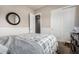 Comfortable bedroom featuring a large window, closet, a ceiling fan and base ball decorations at 3824 E Parkside Ln, Phoenix, AZ 85050