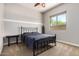 Bedroom featuring a ceiling fan, a large window and neutral paint at 3824 E Parkside Ln, Phoenix, AZ 85050