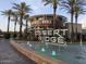 An attractive view of Desert Ridge Marketplace including fountains, shops, and palm trees at 3824 E Parkside Ln, Phoenix, AZ 85050