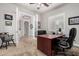 View of home office with neutral colors, carpet, wood desk, and modern furnishings at 3824 E Parkside Ln, Phoenix, AZ 85050