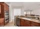 A view of the kitchen features a granite counter, tiled floors, and stainless steel appliances at 3824 E Parkside Ln, Phoenix, AZ 85050
