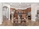 Unique bar-style kitchen with wood cabinets and cowhide barstools at 3824 E Parkside Ln, Phoenix, AZ 85050