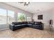 Bright living room with large windows and a comfortable L-shaped sofa at 3824 E Parkside Ln, Phoenix, AZ 85050