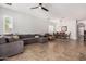 An open-concept living and dining area, featuring tile flooring, neutral color palette, and ample natural light at 3824 E Parkside Ln, Phoenix, AZ 85050