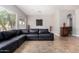 Bright living room with large windows and a comfortable L-shaped sofa at 3824 E Parkside Ln, Phoenix, AZ 85050