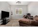 Bright and spacious living room featuring a modern entertainment center and comfortable seating at 3824 E Parkside Ln, Phoenix, AZ 85050