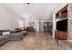 An open floor plan features a living room, dining area, and kitchen with natural light and tiled floors at 3824 E Parkside Ln, Phoenix, AZ 85050