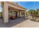 Covered patio with outdoor dining area, desert landscaping, and a relaxing outdoor space at 3824 E Parkside Ln, Phoenix, AZ 85050