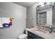 Bathroom featuring a sink, mirror, and toilet at 3935 E Rough Rider Rd # 1164, Phoenix, AZ 85050