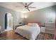 Bright bedroom featuring a ceiling fan, and wood-look floors at 3935 E Rough Rider Rd # 1164, Phoenix, AZ 85050
