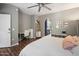 Bright bedroom featuring a desk, bathroom access, and wood-look floors at 3935 E Rough Rider Rd # 1164, Phoenix, AZ 85050