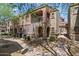 Beautiful townhome featuring stucco finish, balcony, gated entrance, and low maintenance landscaping at 3935 E Rough Rider Rd # 1164, Phoenix, AZ 85050