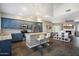 Modern kitchen with stainless appliances, granite counters, and large island with seating at 3935 E Rough Rider Rd # 1164, Phoenix, AZ 85050