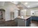 Spacious kitchen features an island with seating, granite countertops and an open floorplan at 3935 E Rough Rider Rd # 1164, Phoenix, AZ 85050