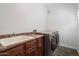 Laundry Room featuring washer, dryer and sink at 3935 E Rough Rider Rd # 1164, Phoenix, AZ 85050