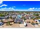 Aerial view of a neighborhood with blue sky, green lawns, solar panels, and RV parking at 4136 W Hearn Rd, Phoenix, AZ 85053