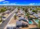 Aerial view of a house with a backyard pool, solar panels, and community at 4136 W Hearn Rd, Phoenix, AZ 85053