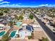 Aerial view of a home with solar panels, a pool, lush green lawns, and RV parking at 4136 W Hearn Rd, Phoenix, AZ 85053