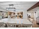 Open-concept dining area with views to the backyard and modern lighting at 4136 W Hearn Rd, Phoenix, AZ 85053