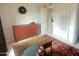 Neutral bedroom featuring a desk and dresser with an open doorway at 4201 E Camelback Rd # 51, Phoenix, AZ 85018