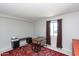 Bright bedroom featuring large window, dark curtain, desk, and rug at 4201 E Camelback Rd # 51, Phoenix, AZ 85018