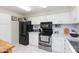 Bright kitchen featuring white cabinets, stainless steel appliances, and neutral countertops at 4201 E Camelback Rd # 51, Phoenix, AZ 85018