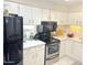 Modern kitchen features white cabinets, stainless steel appliances and efficient layout at 4201 E Camelback Rd # 51, Phoenix, AZ 85018