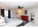 Serene bedroom featuring a ceiling fan, plush patterned bedding, and a unique decor at 4201 E Camelback Rd # 51, Phoenix, AZ 85018