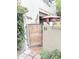 Charming unit patio entrance with gate, mature landscaping, and cozy outdoor space at 4201 E Camelback Rd # 51, Phoenix, AZ 85018
