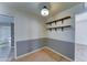 Bonus room with two-toned gray walls, tiled floors, and stylish decor at 4201 W Hatcher Rd, Phoenix, AZ 85051