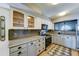 Updated kitchen with stainless steel appliances, granite countertops, and modern cabinetry at 4201 W Hatcher Rd, Phoenix, AZ 85051