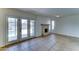 Living room with tile floors and a cozy fireplace with access to the backyard and pool area at 4201 W Hatcher Rd, Phoenix, AZ 85051