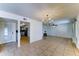Open-concept living room with tile flooring offering seamless access to the kitchen area at 4201 W Hatcher Rd, Phoenix, AZ 85051