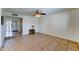 Living room featuring tile flooring and a decorative accent wall, offering a blend of style and comfort at 4201 W Hatcher Rd, Phoenix, AZ 85051