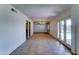 Large living room with tile flooring, seamlessly connecting to the outdoor pool area at 4201 W Hatcher Rd, Phoenix, AZ 85051