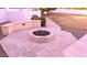 Backyard patio with built-in seating and cozy fire pit for outdoor gatherings at 4304 W Calle Poco --, Laveen, AZ 85339