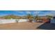 Expansive gravel backyard featuring mountain views and a secure metal gate at 4304 W Calle Poco --, Laveen, AZ 85339