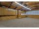 Spacious basement with wood paneling and carpeting offers flexible living space at 4304 W Calle Poco --, Laveen, AZ 85339