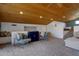 Carpeted bonus room with vaulted wood ceiling and raised sleeping area at 4304 W Calle Poco --, Laveen, AZ 85339