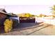 Gravel driveway with a gated entrance and well-maintained landscape at 4304 W Calle Poco --, Laveen, AZ 85339