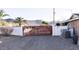 Gated driveway with white brick perimeter and mature landscaping at 4304 W Calle Poco --, Laveen, AZ 85339