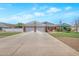 Charming single-story home with a brick facade, a spacious driveway, and a well-maintained lawn at 4304 W Calle Poco --, Laveen, AZ 85339