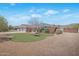 Charming single-story home with a brick facade, a spacious driveway, and a well-maintained lawn at 4304 W Calle Poco --, Laveen, AZ 85339