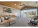 Carpeted living room has vaulted ceilings, great views, and access to a patio at 4304 W Calle Poco --, Laveen, AZ 85339
