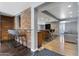 Open-concept living area featuring a bar, kitchen access, and cozy seating at 4304 W Calle Poco --, Laveen, AZ 85339